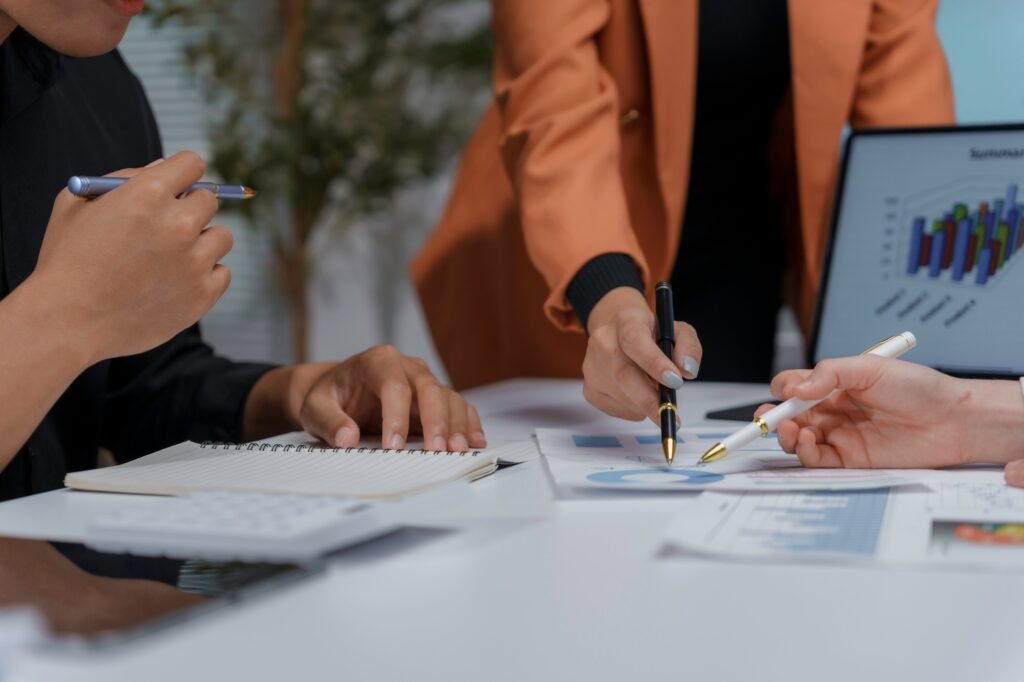 Business team analyzing financial charts and making strategic decisions