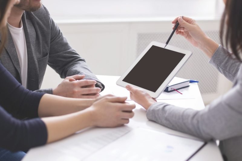 Expert explaining contract terms and advantages to new clients